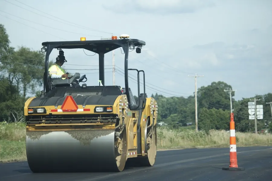Roller making a compaction pass on new blacktop